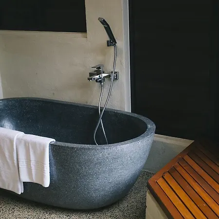 Sand&Sandals Desaru Beach Resort&Spa Bagian luar foto A freestanding stone bathtub